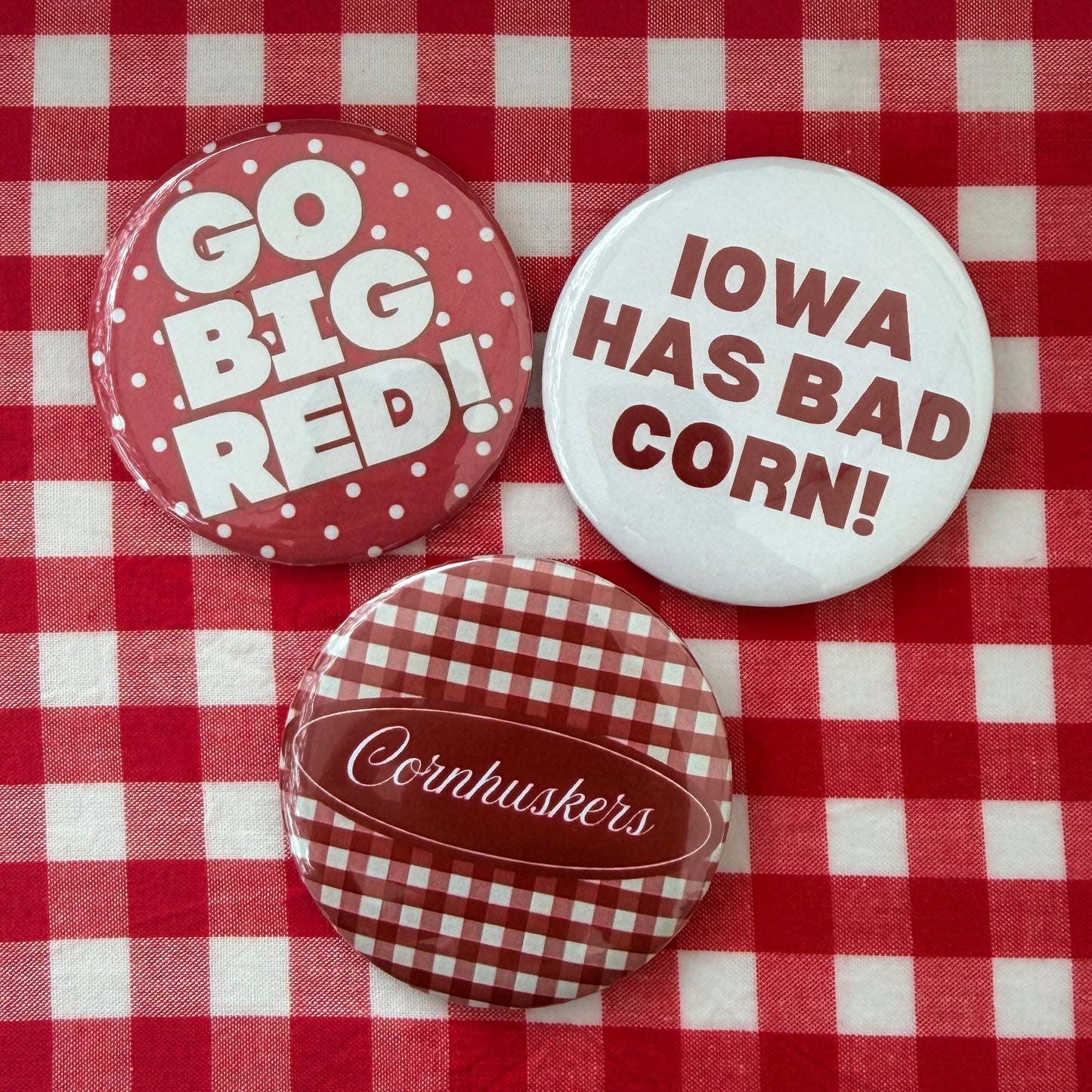 Nebraska Huskers button set with three red and white game day pinback buttons
