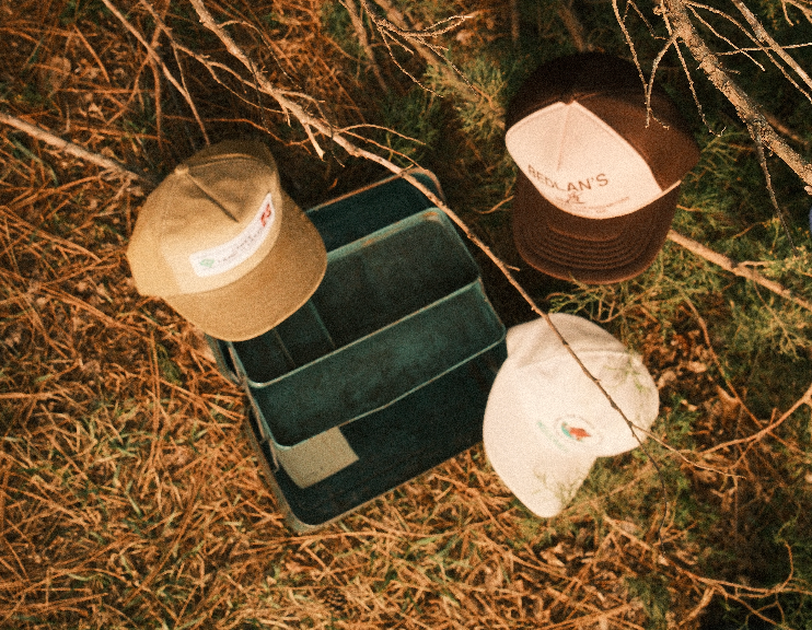 Vintage hats scattered around tackle box