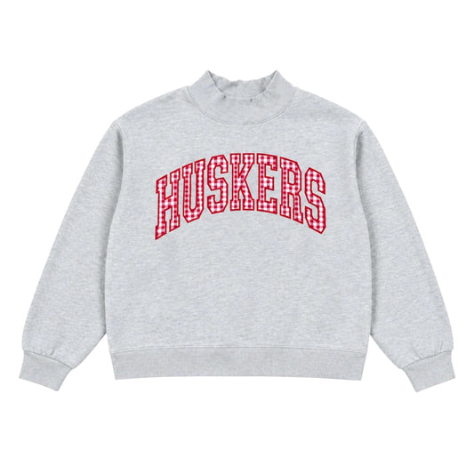 Gray Nebraska Huskers mockneck sweatshirt with red outlined gingham pattern HUSKERS lettering
