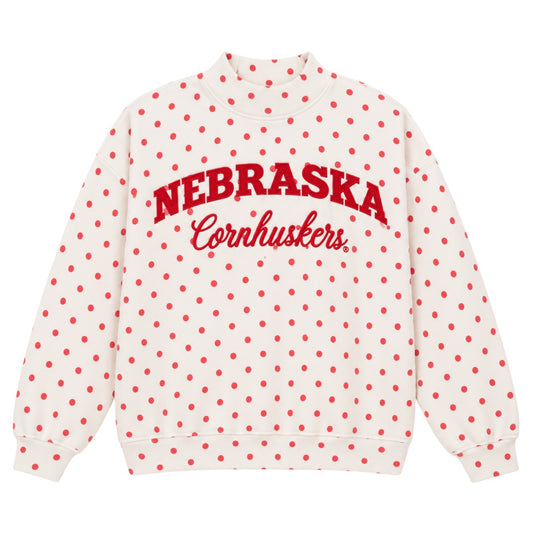 White Nebraska Cornhuskers mockneck sweatshirt with red polka dots and red Nebraska Cornhuskers lettering