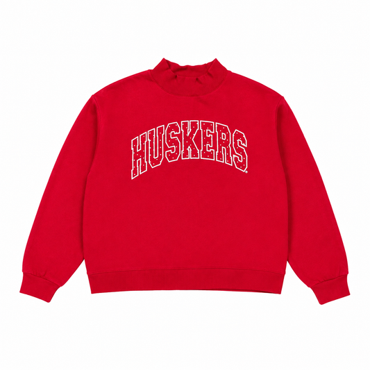 Retro red Nebraska Huskers mockneck sweatshirt with white polka dot arched HUSKERS lettering.